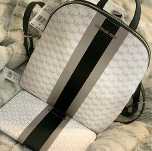Authentic Michael Kors bag with matching wallet.